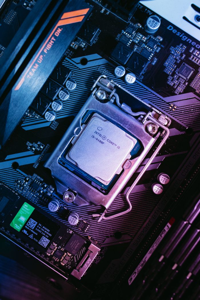 Home Detailed view of a computer motherboard with installed CPU, showcasing high-tech components.